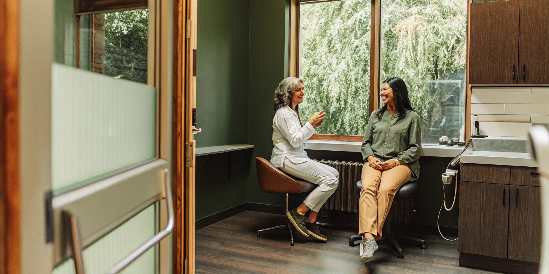 Dental implant specialist consulting with a patient in Lowell MA